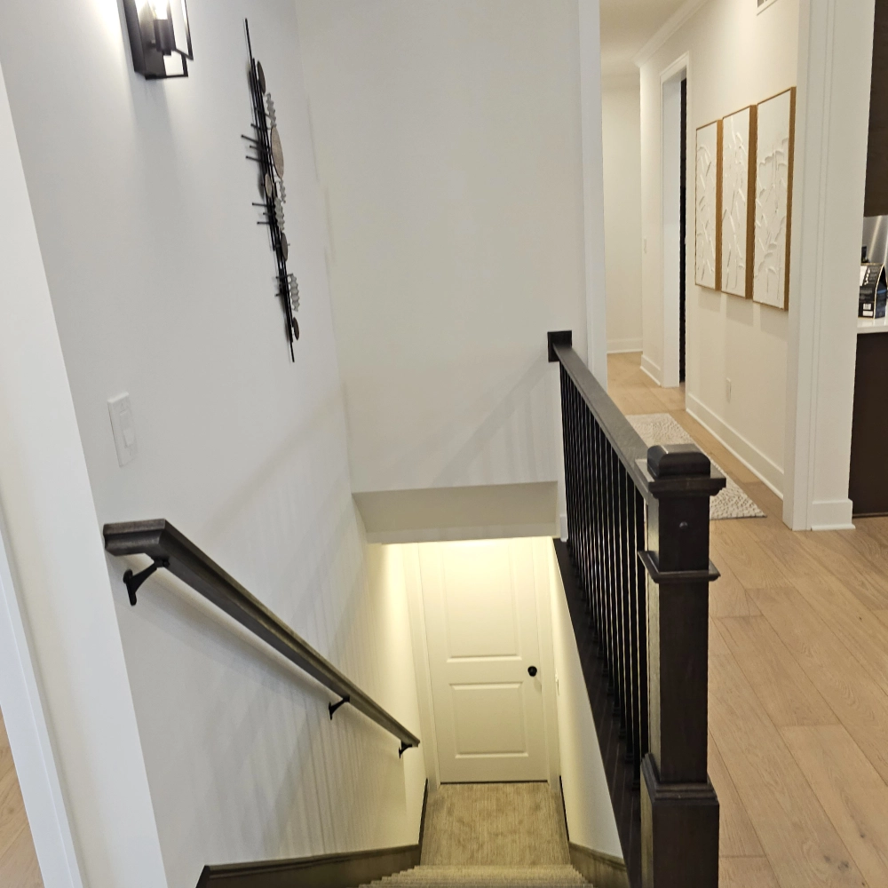 Entry to stairs - Mistwood Model Home Macomb MI